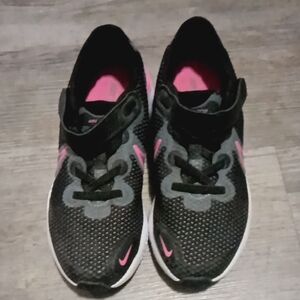 Nike Kids' Renew Run shoes in black and pink. 